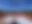 Mehrere Sand-Tennisplätze unter blauem Himmel